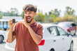 © luismolinero - Young Arabian handsome man holding car key at outdoors whispering something