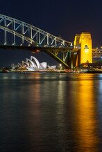 A Symphony Of Design And Engineering: Sydney's Iconic Opera House And Harbour Bridge.