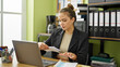 © Krakenimages.com - Young beautiful hispanic woman business worker holding letter working at office