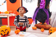 © Krakenimages.com - Adorable hispanic boy wearing pirate costume standing at home