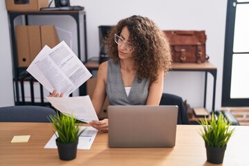 Sticker - Young beautiful hispanic woman business worker using laptop reading document at office