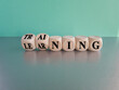 © Liudmila - Training and learning symbol. Turned wooden cubes and changes the word training to learning. Beautiful gray table, blue background. Business, training and learning concept. Copy space.