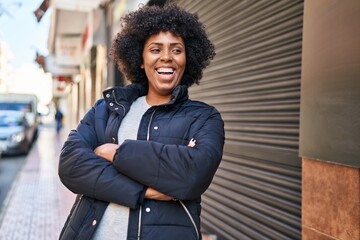 Sticker - African american woman standing with arms crossed gesture at street