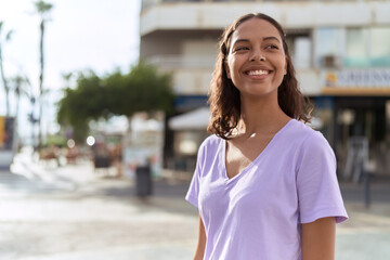 Sticker - Young african american woman smiling confident looking to the side at street