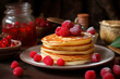 pancakes with raspberries and red currants on the tea table, close-up