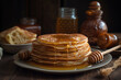 pancakes with honey on a wooden table, close-up
