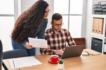 Canvas Print - Man and woman business workers working at office