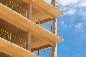 Close up of structural components of an engineered timber multi story green, sustainable residential high rise apartment building construction project