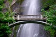 Suspension bridge above waterfalls.   Multnomah Falls in Columbia River gorge. Oregon. USA