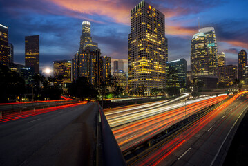 Wall Mural - Cityscape in night time in Los angeles with road and highway