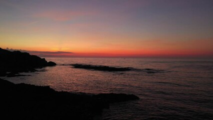 Wall Mural - Hanh Den Lighthouse light on the stone shore. The powerful lighthouse illuminated. Phu Yen, Vietnam
