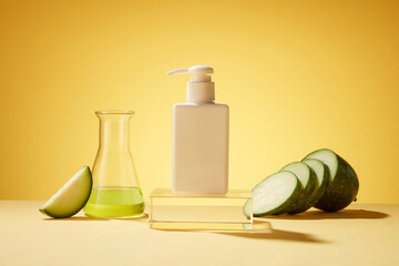 Wall Mural - Against the yellow background, a white pump bottle unbranded decorated with erlenmeyer flask and fresh winter melon slices. Mockup scene for advertising cosmetic product, body lotion or cleanser.