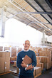 © Y.A./peopleimages.com - Manager, smile and portrait of man in warehouse for cargo, storage and shipping. Distribution, ecommerce and logistics with employee in factory plant for supply chain, package or wholesale supplier
