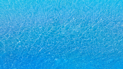 Wall Mural - Aerial view of the Overhead view of crystal clear water on beach background