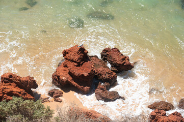 Wall Mural - Top view of rocks in the ocean 