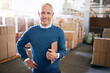 © Y.A./peopleimages.com - Checklist, manager and portrait of man in warehouse for cargo, storage and shipping. Delivery, ecommerce and logistics with employee in factory plant for supply chain, package or wholesale supplier