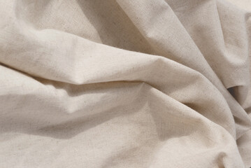 soft draped neutral beige linen fabric texture, aesthetic textile background with abstract folds, we