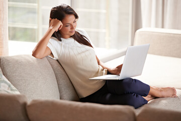 Wall Mural - Laptop, internet and a woman relax at home while streaming movies. Calm female person on lounge couch browsing and reading email, research or social media and online shopping with tech connection