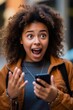 © MiraCle72 - Young woman positively surprised after message from mobile phone, created with generative AI