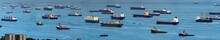 Wide Panorama Image Of Container Ships Anchored At The Singapore Strait.