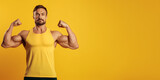 Fototapeta  - Handsome fit, athletic young man showing his muscles isolated on solid color background.