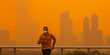An athlete runs through the streets as wildfire smoke bathed New York City in fumes - Generative AI