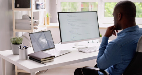 Fototapete - Computer Programmer Writing Program Code On Computer