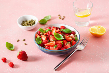 Wall Mural - watermelon salad with strawberry raspberry basil seeds. healthy summer dessert