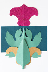 Poster - composite shape consisting of cut paper decor and final or floral elements on white