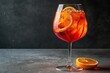 aperol spritz cocktail in a wine glass on a gray backdrop, summer beverages, place a copy. Generative AI
