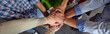 © Friends Stock - Top view of different ethnicity business people doing fists bump, celebrating success while standing in the office