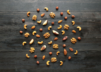Wall Mural - Pattern of nuts mix on wooden background