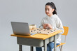 © Blue Jean Images - Cute girl playing the game of Go with laptop