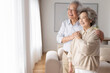 © Blue Jean Images - Cheerful senior couple relaxing at home