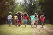© alisaaa - Rearview of a group of diverse and playful children sprinting to play with their friends