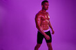 © SHOTPRIME STUDIO - Man athletic bodybuilder poses with nude torso abs in full-length background, boxing and martial arts. Advertising, sports, active lifestyle, color light, competition, challenge concept.