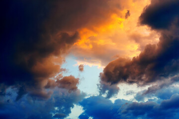 stormy sky with clouds with blue and yellow hues and sky center