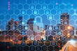 Panoramic view of Broadway district of Nashville over Cumberland River at illuminated night skyline, Tennessee, USA. Padlock hologram. The concept of cyber security to protect confidential information