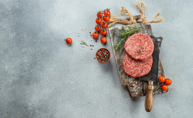 Wall Mural - Raw mince beef meat Burger steak cutlets on a light background, Long banner format. top view