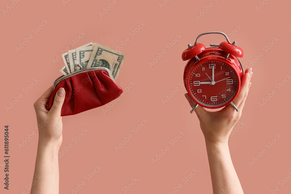 Woman with alarm clock, wallet and dollar banknotes on color background