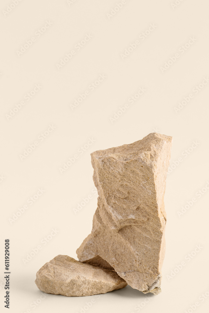 Decorative stone podiums on beige background