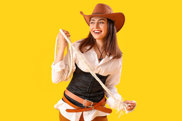 Poster - Beautiful cowgirl with lasso on yellow background