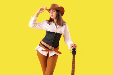 Poster - Beautiful cowgirl with guitar on yellow background