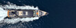 © aerial-drone - Aerial drone ultra wide panoramic photo of luxury yacht bow with wooden deck cruising in high speed the Mediterranean deep blue sea