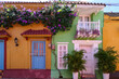 Colorful house facades with balconies and flowering gplants in the old town of Cartagena on a sunny day, Colombia