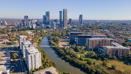 Wall Mural - Aerial drone view of Parramatta CBD above Parramatta River in Greater Western Sydney, NSW, Australia showing development of the city as at June 2023