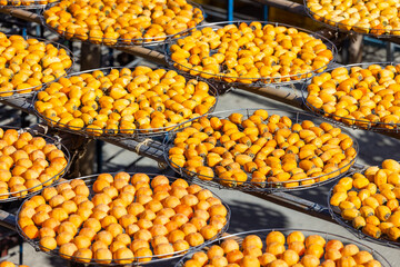 Poster - Peeled persimmons drying at outdoor