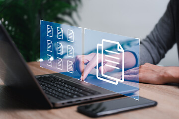 Document management concept, Business women use laptop management electronic documents online for easy and convenient document management in a modern document storage system.