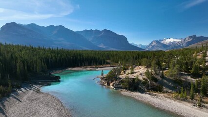 Wall Mural - a drone view of the river in the mountains valley. an aerial view of an autumn forest. winding river