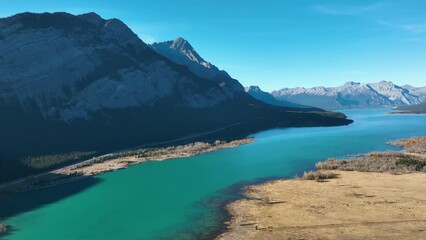 Wall Mural - a drone view of the river in the mountains valley. an aerial view of an autumn forest. winding river
